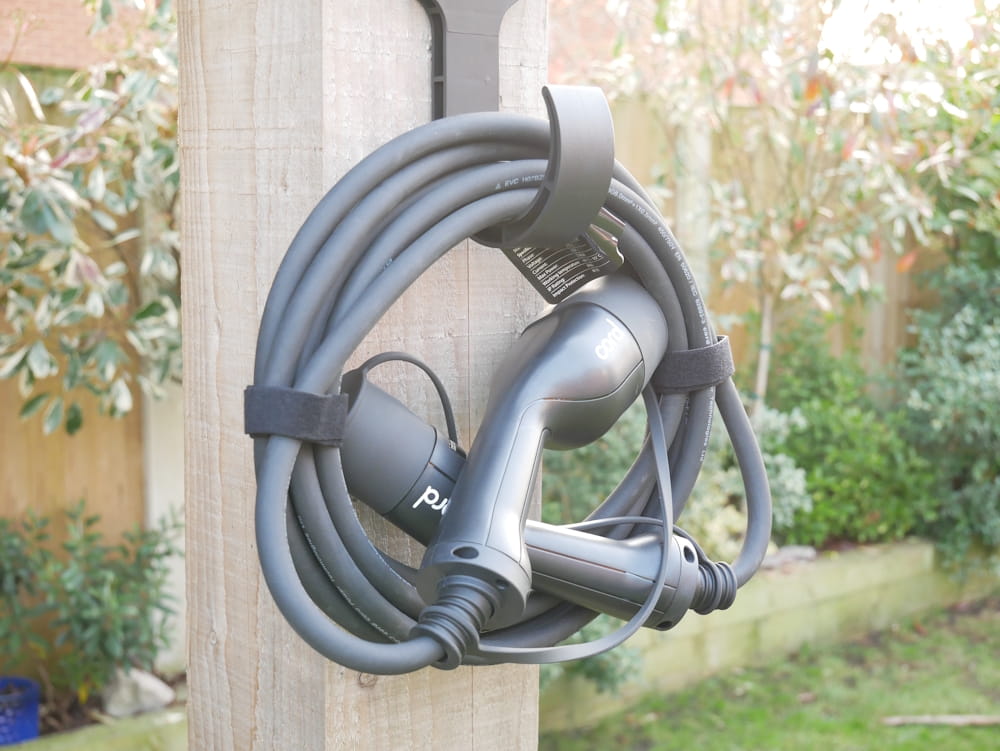 Cord Type 2 charging cable hung up on a wall mount