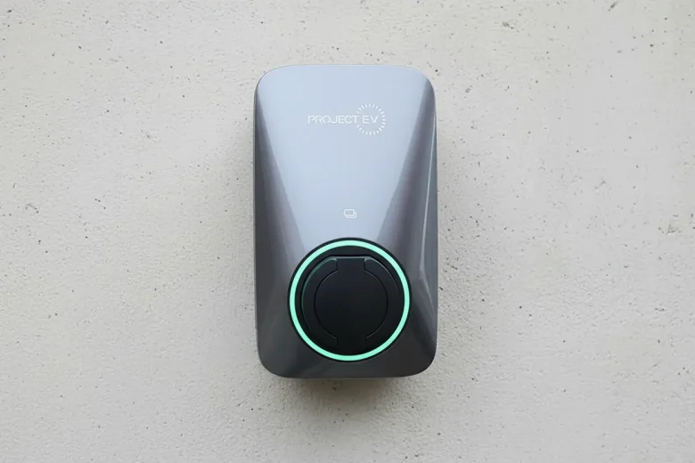 Project charger - the Apex EV charger installed on a concrete wall outside