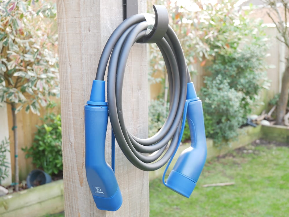 Voldt Type 2 charging cable hung up on a wall mount