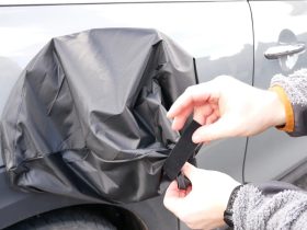 Charging port cover to protect